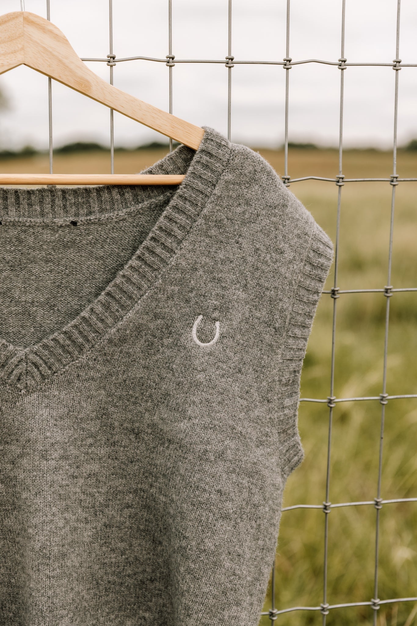 The Embroidered Horseshoe Sweater Vest in Grey